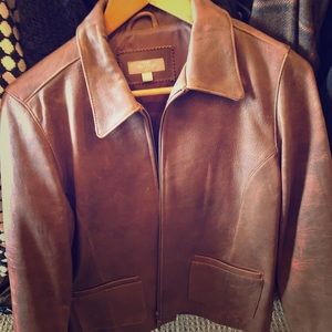 Classic brown leather jacket; size small.